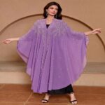 Swimming Gear Hooded cape-style top with rhinestone and bead embellishments